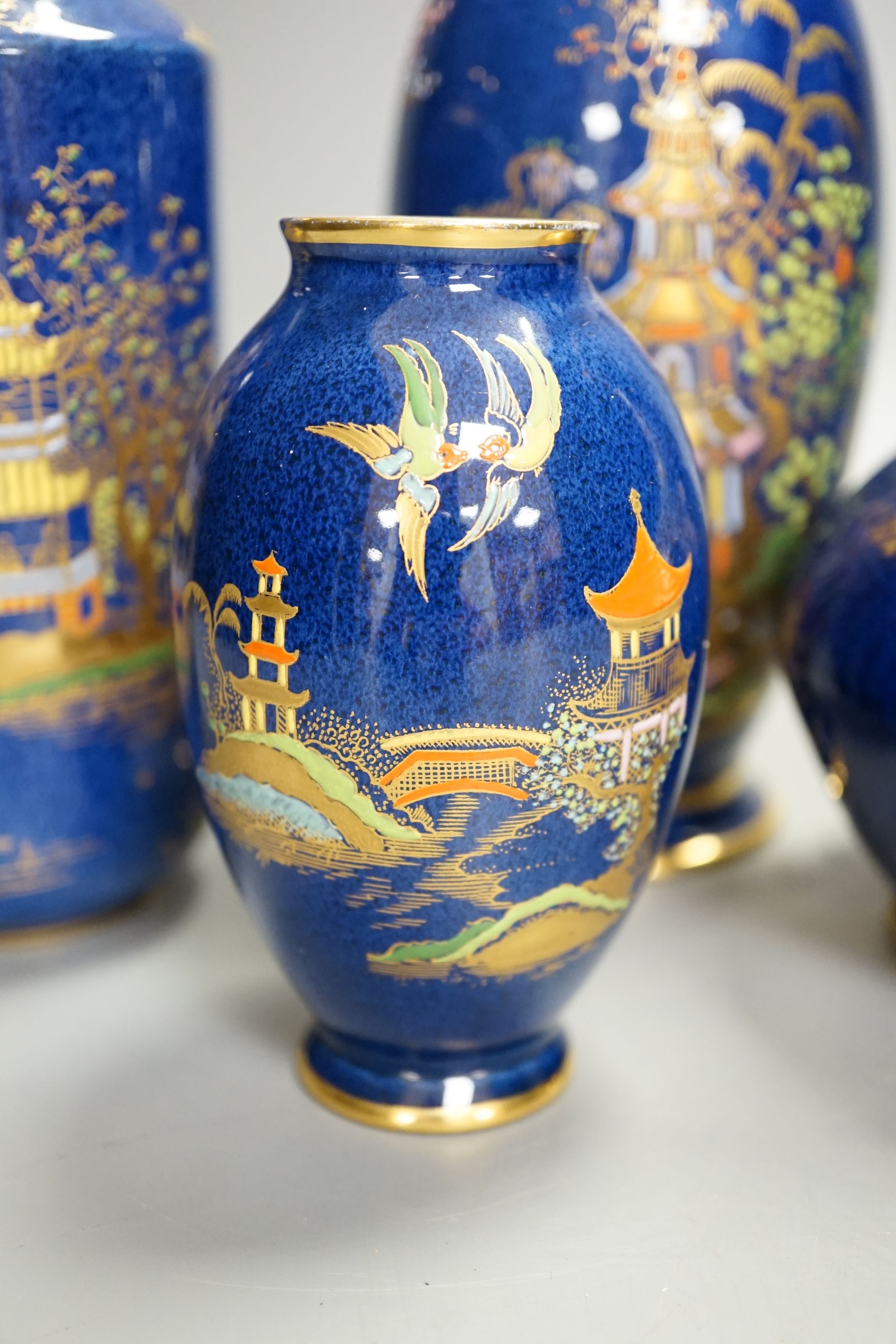 A group of Carlton ware blue ground chinoiserie lustre vases, tallest 18cm (5)